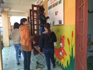 Teachers in Sapa work to beautify a school.